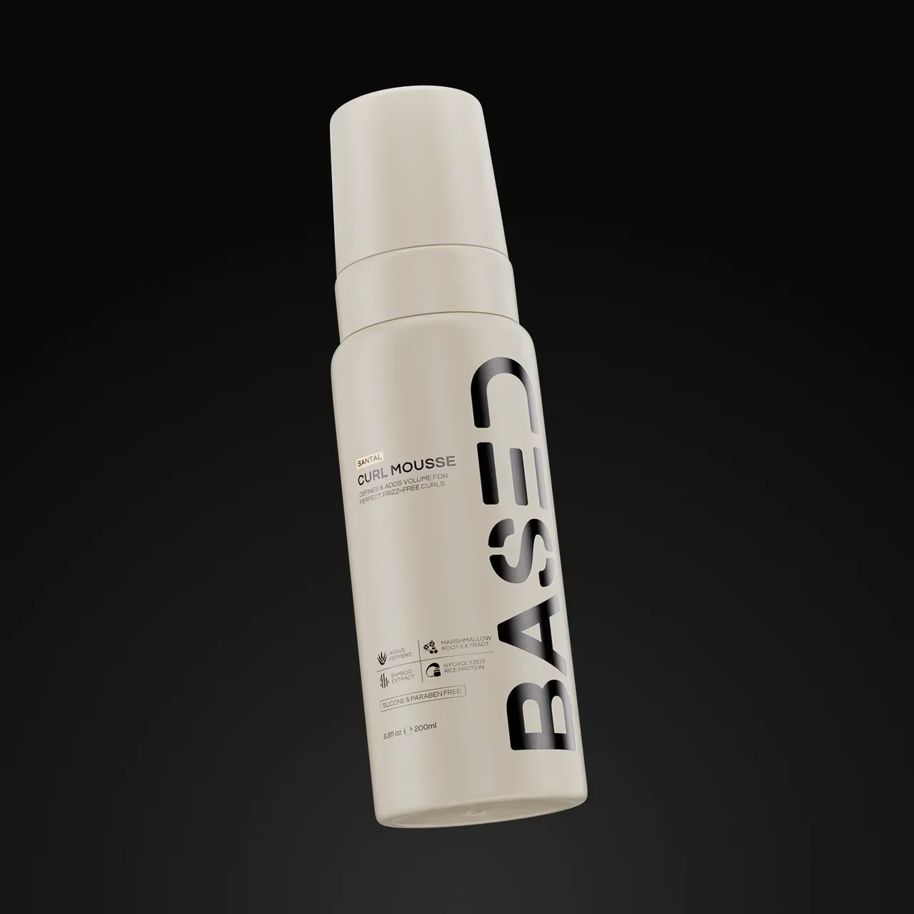 BASED Curl Mousse bottle with pump cap on a black background, showing ingredient icons and label.