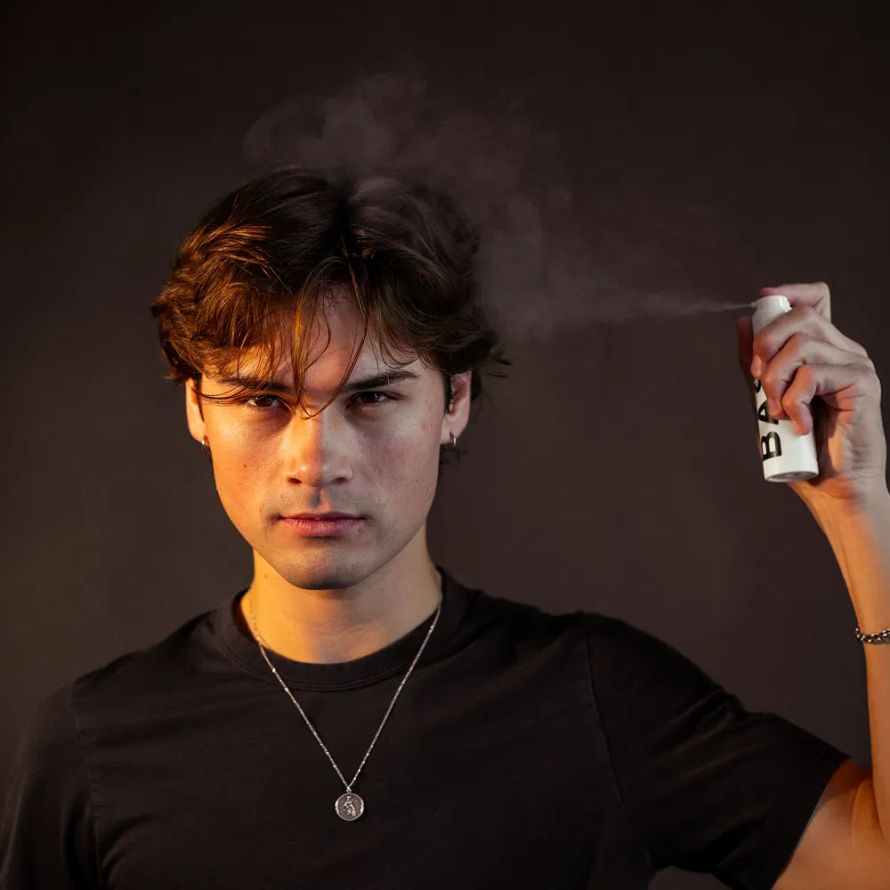 Man applying BASED Texture Powder for instant volume and texture