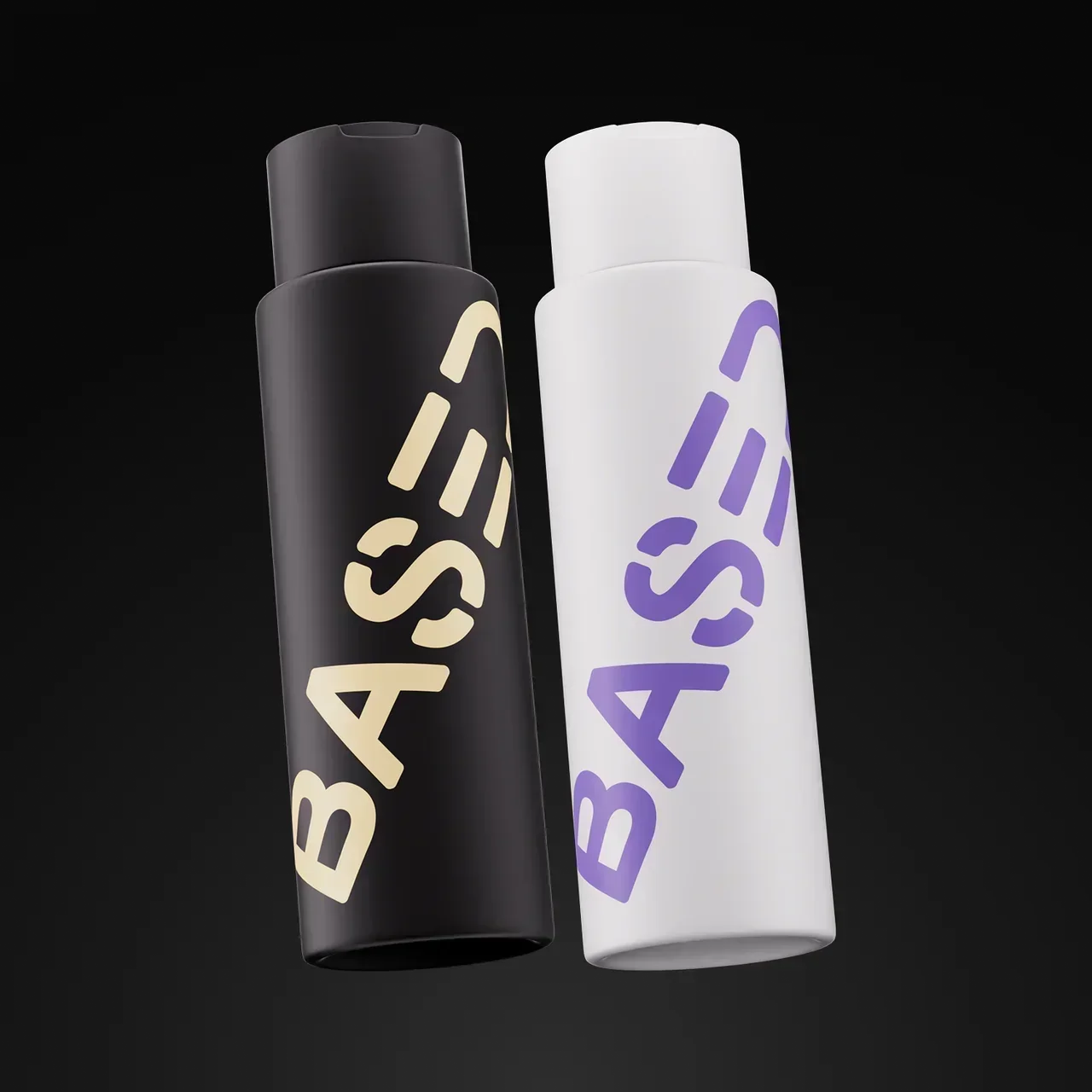 BASED Shower Duo – black and white bottles standing side by side against a dark background.